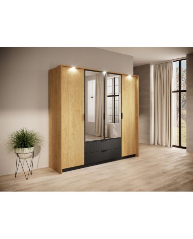 Armoire BALTINO – Élégance moderne, fonctionnalité maximale  Le style urbain chic s’invite dans votre chambre